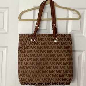Michael Kors tote with leather straps 13x14x4.